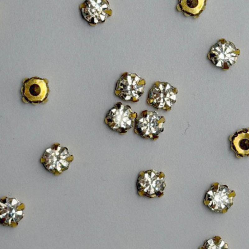 White Round Crystal with Gold Claw Setting