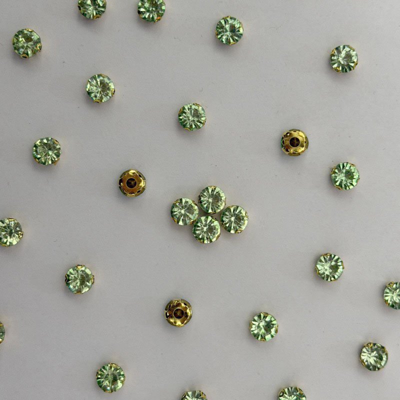 Light Green Round Crystal with Gold Claw Setting