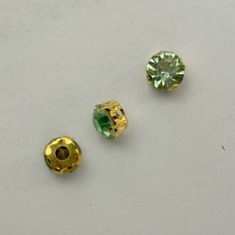 Light Green Round Crystal with Gold Claw Setting