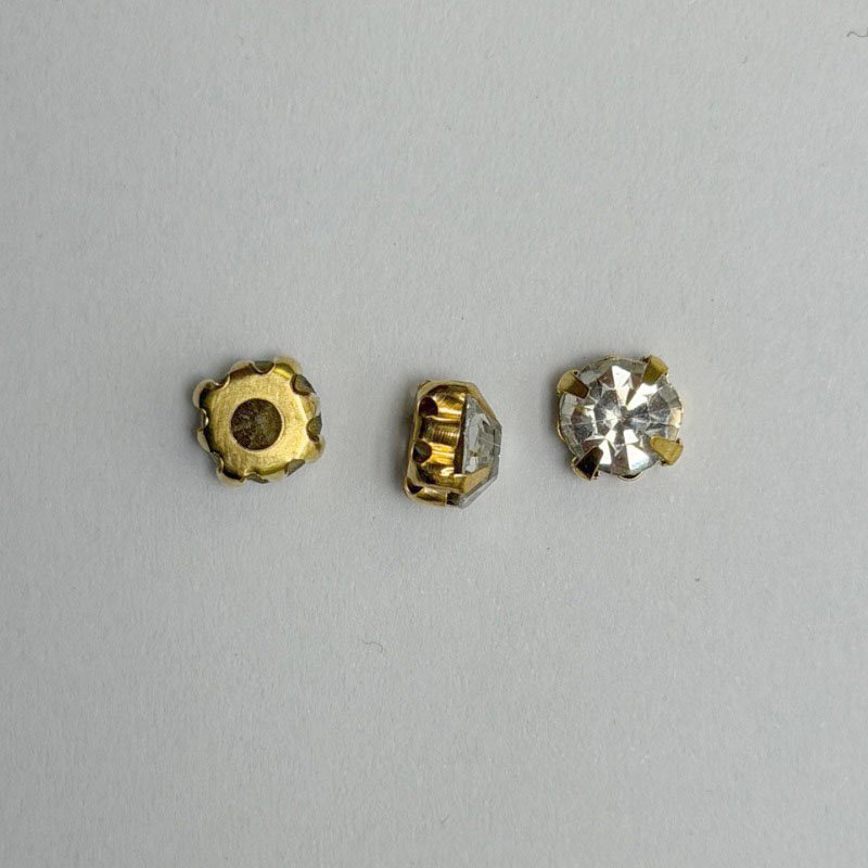 White Round Crystal with Gold Claw Setting